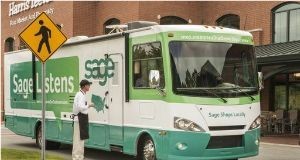 John Elliot, owner of Davidson Chocolate Co. in Davidson, N.C., and a Sage customer, meets Sage bus.