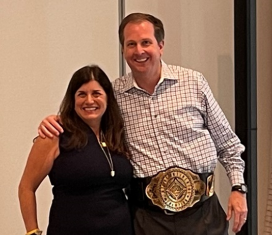 New CEO of UKG Vows to Expand By Flipping A Catch-22 Moment To Its Advantage Chris Todd, the new CEO of UKG, is presented with a champion belt by Jennifer Brafman Staffen of UKG Corporate Communications during a June 2022 Analyst Relations event in Fort Lauderdale, FL